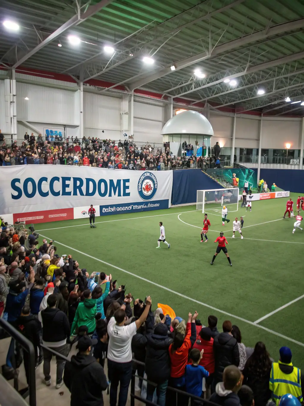 A lively scene from a community soccer tournament, with players, spectators, and colorful ESCQ banners creating a festive atmosphere.